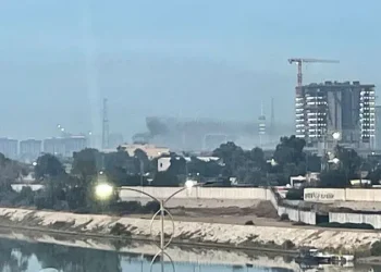 Smoke rises above buildings in Baghdad