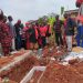 Weta Traditional Authorities performing pacification rituals at the graveside