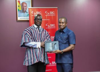 Managing Director of SIC Insurance Plc, James Agyenim-Boateng [right], former Black Stars captain Stephen Appiah [left].