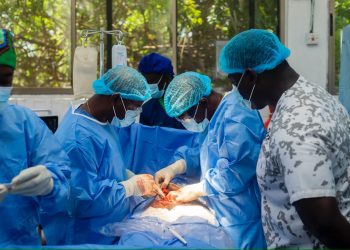 Dr. Rex Djokoto,  Consultant Obstetrician Gynaecologist, (right) supervising one of the surgeries during the outreach