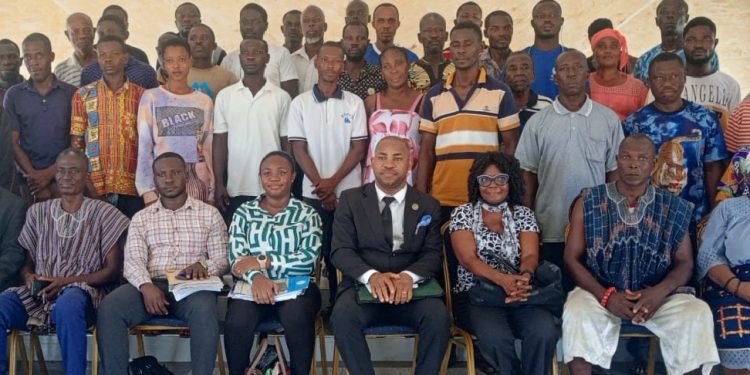 CHRAJ Head of Business and Human Rights, Clement Kadogbe(in suit) and some of the victims