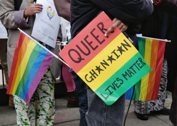 2H3017A London, UK. An activist holds a sign at a protest against Ghana's far-reaching anti-gay law being debated in the country's parliament.