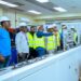 The Minister for Energy and Green Transition, John Jinapor in company of some engineers inside one of the operation rooms at the Akosombo Dam