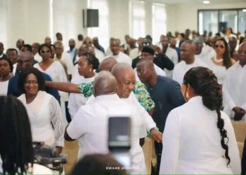 Photograph of President John Dramani Mahama hugging Chief of Staff Julius Debrah