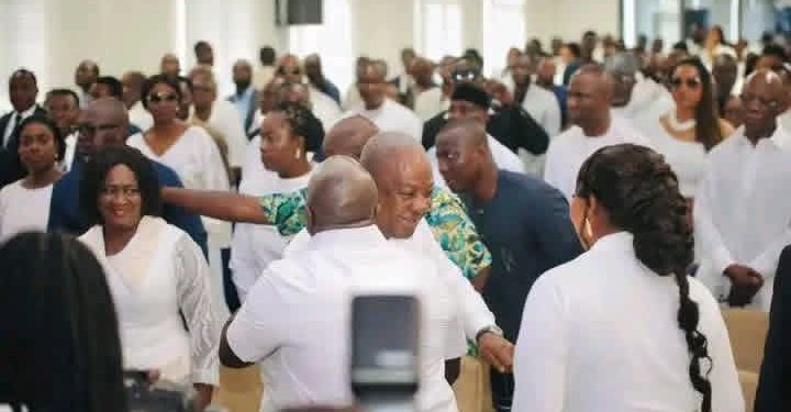 Photograph of President John Dramani Mahama hugging Chief of Staff Julius Debrah