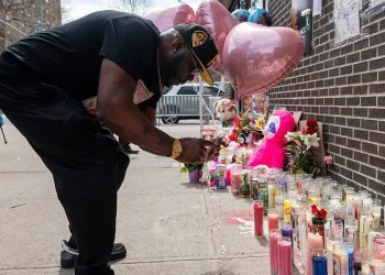 A memorial has been growing at the scene of the shooting in Williamsburg. Photo Credit: Getty Images