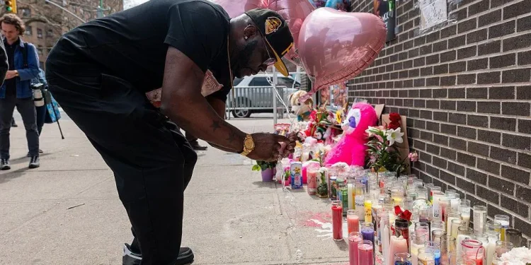A memorial has been growing at the scene of the shooting in Williamsburg. Photo Credit: Getty Images
