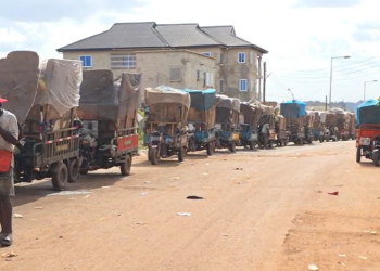 Tricycle operators lined up at Oti Landfill Site