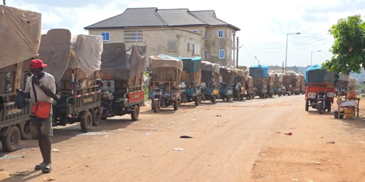 Tricycle operators lined up at Oti Landfill Site