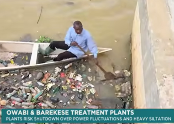 GWL staff clearing plastics accumulated in the Owabi Dam