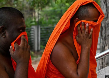 Two of the arrested monks arriving at court on Sunday