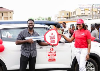 Telecel Ghana presents brand-new Hyundai Creta to Cycle 14 winner of its Dream Car Promo, Kofi Ofosu-Ennin at the Kaneshie Market in Accra.