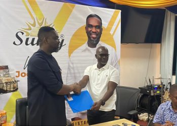 gospel musician Joe Mettle(left), Oxy Industries Limited Head of Sales and Marketing, Ekow Daniel