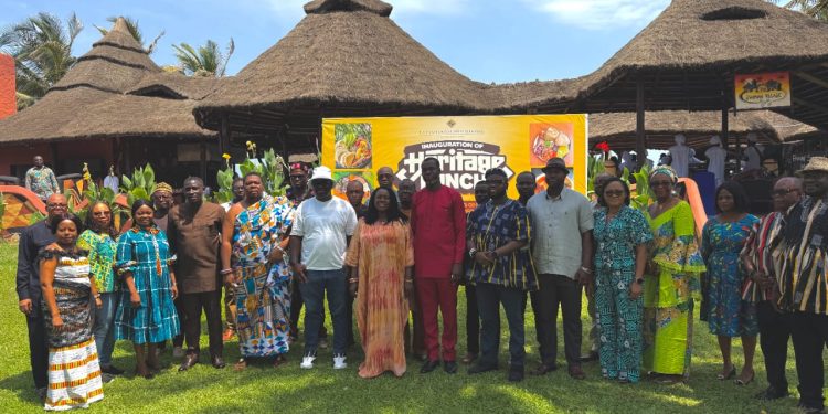 The Deputy Minister/MP, La Dade-Kotopon, (centre) in a group photograph with other dignitaries after the launch