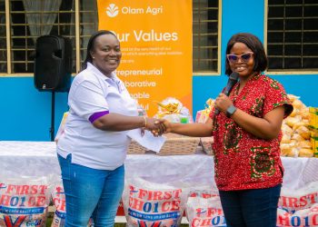 Ms Juliet Amuah, Vice President of Olam Agri’s empOWer hands over assorted products to a management representative of HopeSetters Autism Centre.