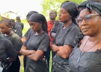 Some mourners at the burial site