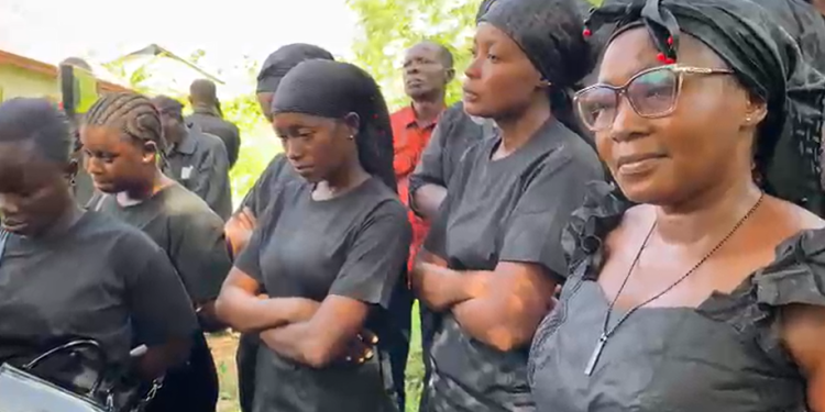 Some mourners at the burial site