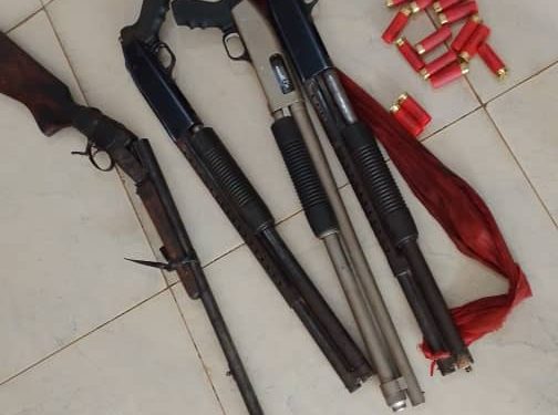 Pump-action guns and single-barrel gun retrieved from the scene