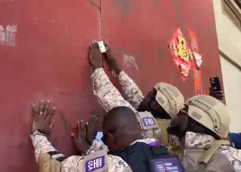 Officials locking up the Chinese-owned manufacturing company.