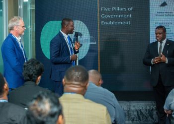 David Gowu, Chief Executive Officer, BOSAG (centre with microphone) engaging in discussions with Minister for Communication, Digital Technology and Innovations, Samuel Nartey George (right) at the High-Level Government–Industry Roundtable on Ghana’s BPO/GBS Sector event