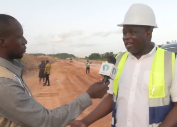 Minister for Roads and Highways, Governs Kwame Agbodza [right]