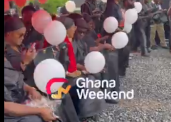 Mourners holding balloons