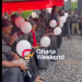Mourners holding balloons