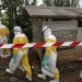 Doctors Without Borders teams wearing full protective equipment reinforce perimeter barriers around a restricted Ebola isolation zone and basic hygiene facilities, including toilets designated for suspected Ebola patients, at the General Referral Hospital of Mongbwalu on May 26, in Mongbwalu, Democratic Republic of Congo.
(Michel Lunanga/Getty Images)