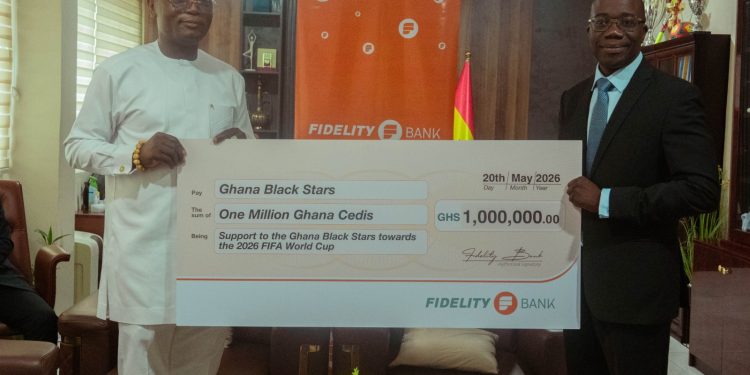 Julian Opuni, Managing Director (right) presenting the cheque to the Hon. Kofi Iddie Adams, Minsi (left) at a brief ceremoney at the Ministry of Sports and Recreation