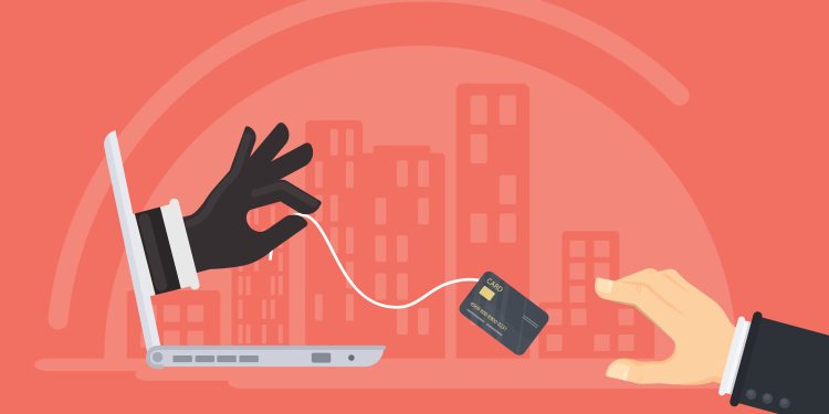 Credit card stealing. Thief steals money from the credit card through the man's laptop. Red background.