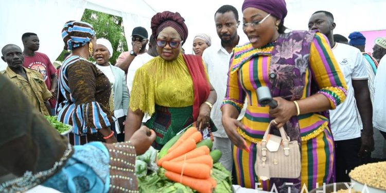 Deputy Minority Leader, Patricia Appiagyei, with the Member of Parliament for Savelugu Constituency, Hajia Fatahiya Abdul Aziz and women farmers