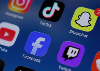 Instagram, TikTok, Snapchat, YouTube, Facebook, Twitch and Reddit applications are displayed on a mobile phone in this picture illustration taken on December 9, 2025. REUTERS/Hollie Adams/Illustration/File Photo Purchase Licensing Rights