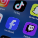 Instagram, TikTok, Snapchat, YouTube, Facebook, Twitch and Reddit applications are displayed on a mobile phone in this picture illustration taken on December 9, 2025. REUTERS/Hollie Adams/Illustration/File Photo Purchase Licensing Rights