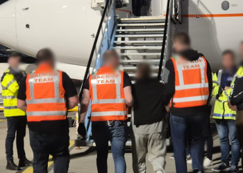 A deportation operation at Dublin Airport last year. The latest of four such operations took place on Thursday, when 42 people were deported to South Africa. Photograph: An Garda Síochána