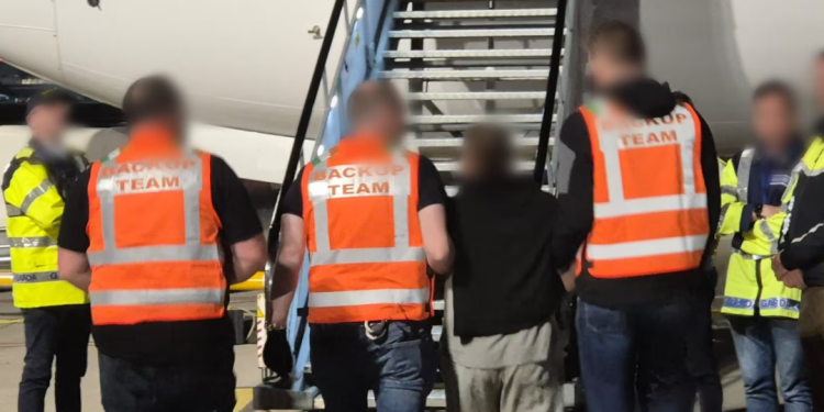 A deportation operation at Dublin Airport last year. The latest of four such operations took place on Thursday, when 42 people were deported to South Africa. Photograph: An Garda Síochána