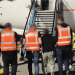 A deportation operation at Dublin Airport last year. The latest of four such operations took place on Thursday, when 42 people were deported to South Africa. Photograph: An Garda Síochána