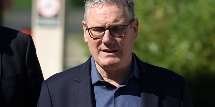 Britain's Prime Minister Keir Starmer walks as he visits a housing development in north London, Britain, June 19, 2026. Peter Macdiarmid/Pool via REUTERS Purchase Licensing Rights