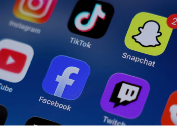 Instagram, TikTok, Snapchat, YouTube, Facebook, Twitch and Reddit applications are displayed on a mobile phone in this picture illustration taken on December 9, 2025. REUTERS/Hollie Adams/Illustration/File Photo Purchase Licensing Rights