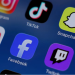 Instagram, TikTok, Snapchat, YouTube, Facebook, Twitch and Reddit applications are displayed on a mobile phone in this picture illustration taken on December 9, 2025. REUTERS/Hollie Adams/Illustration/File Photo Purchase Licensing Rights