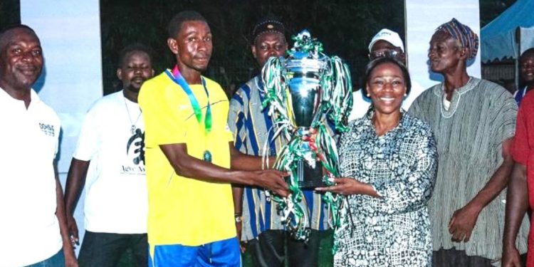 Dr. Grace Ayensu-Danquah, Member of Parliament for Essikado-Ketan, presents the championship trophy to the winning team of the 2026 Dr. Grace Community League.
