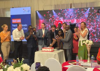 German Ambassador to Ghana, Frederik Landshoft, with young entrepreneurs, innovators, cutting a cake