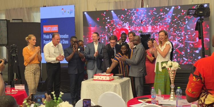 German Ambassador to Ghana, Frederik Landshoft, with young entrepreneurs, innovators, cutting a cake