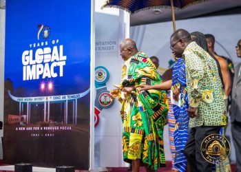 Asantehene Otumfuo Osei Tutu II unveils the commemorative anniversary book, 70 Years of Global Impact, which featured Telecel CEO, Ing. Patricia Obo-Nai.