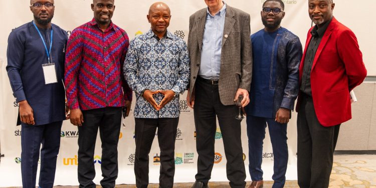 Ras Mubarak, Founder and Leader of the Pan African Initiative Promoting a Visa-Free Africa by 2030 [middle] in African print.