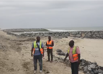 Ablekuma West Municipal Chief Executive, George Kpakpo Allotey and other officials at the Defence project site at Dansoman