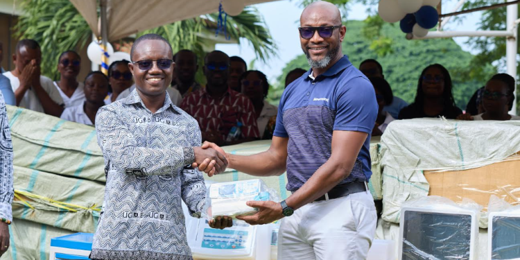 David Johnson, Director, External Relations and Communications at Newmont (right), handing over the equipment to Prof. Gordon Abeka Nkrumah (left), Hospital Management Committee Chair of the University of Ghana Health Services.