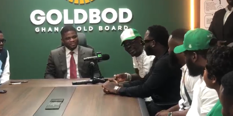 Award-winning Ghanaian dancehall artiste Shatta Wale and his team, including rapper Medikal [right], with the Chief Executive Officer of the Ghana Gold Board, Sammy Gyamfi, and his team [left].