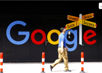 A man walks past a logo of Google in front of at an office building in Zurich, Switzerland July 1, 2020. REUTERS/Arnd Wiegmann Purchase Licensing Rights