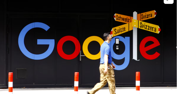 A man walks past a logo of Google in front of at an office building in Zurich, Switzerland July 1, 2020. REUTERS/Arnd Wiegmann Purchase Licensing Rights
