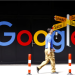 A man walks past a logo of Google in front of at an office building in Zurich, Switzerland July 1, 2020. REUTERS/Arnd Wiegmann Purchase Licensing Rights
